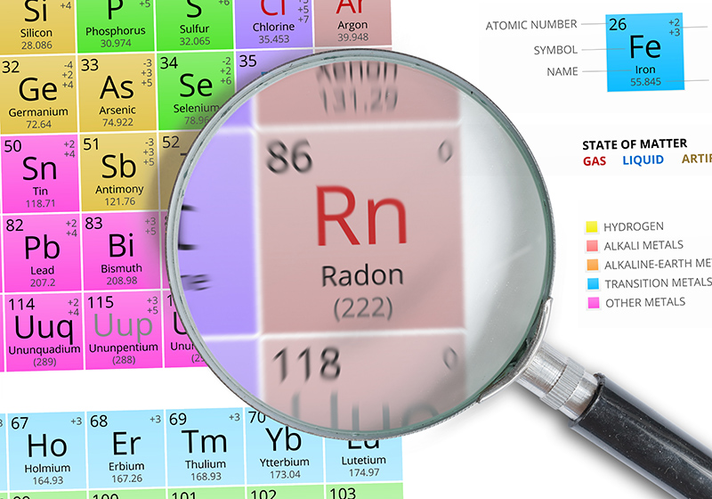 Radon - Element of Mendeleev Periodic table magnified with magnifying glass